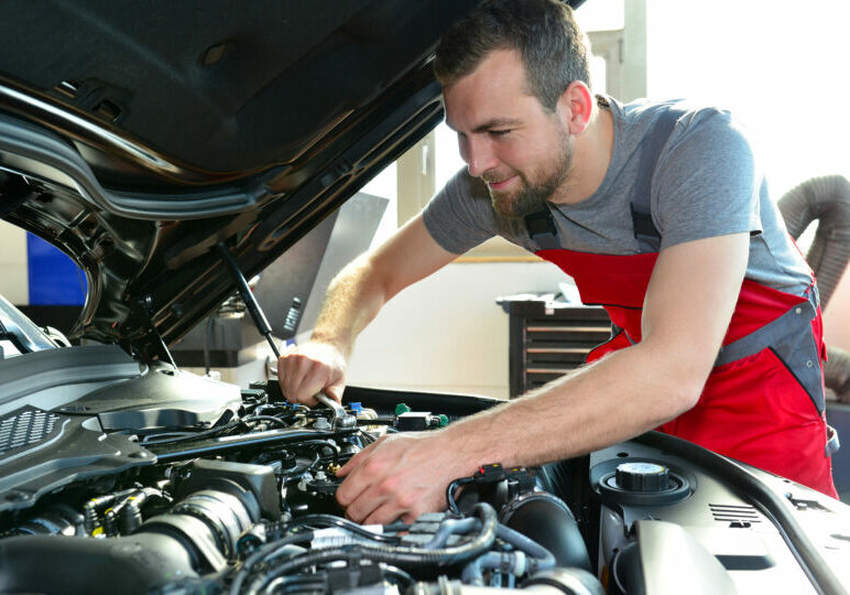 Professional Mechanic Repairs Engine Of Car